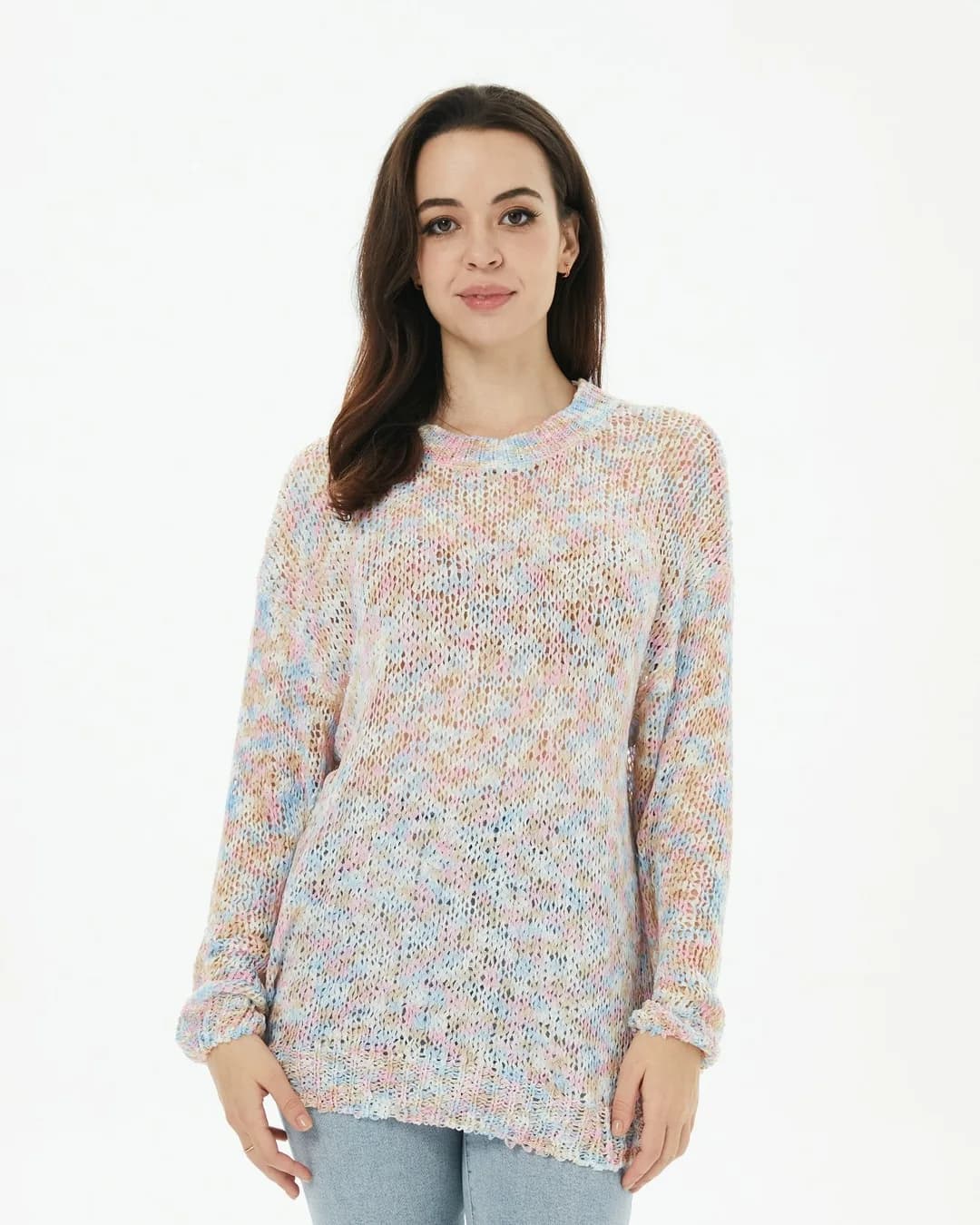 Woman in a pastel space-dyed knit sweater on a white background